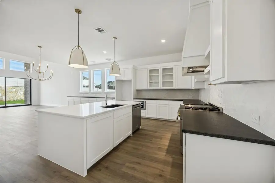 Featuring a perfectly designed open concept floor plan, the chef will never be left out of the party in our Justin floor plan!