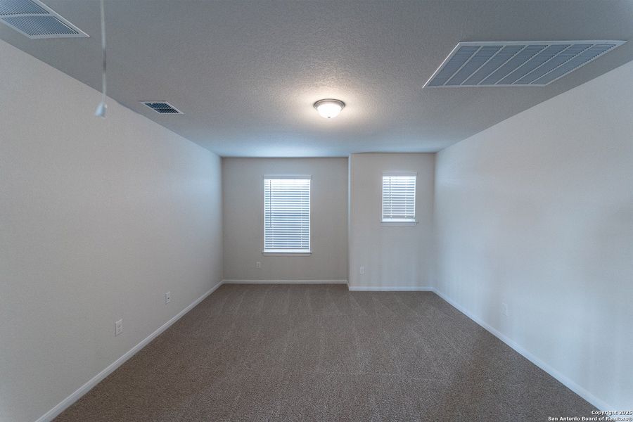 Spacious, unfurnished interior of a new home in Hunter's Ranch, San Antonio (Image 17).