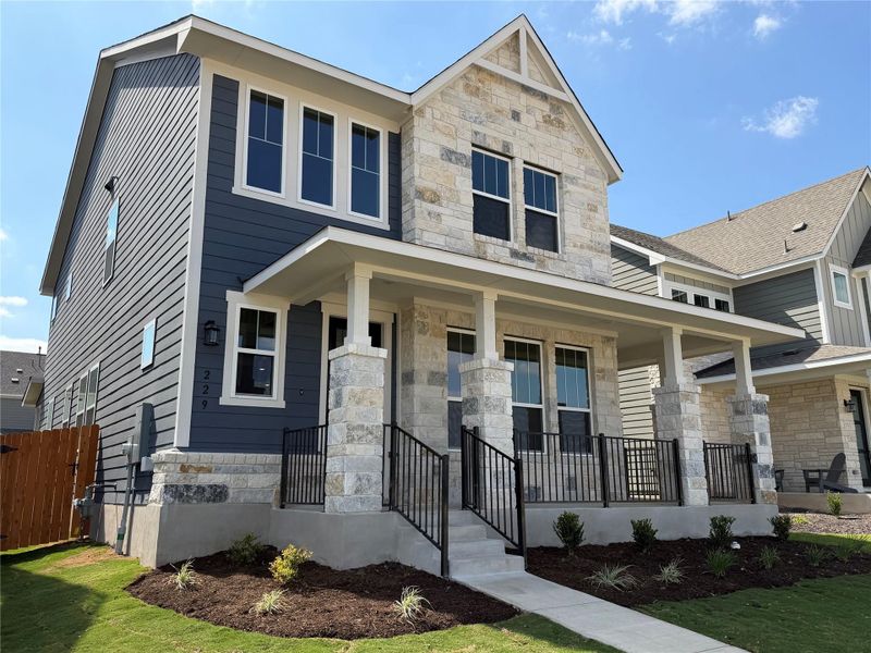 Front exterior of a new home in Lariat, Liberty Hill, TX, highlighting curb appeal (Image 19).