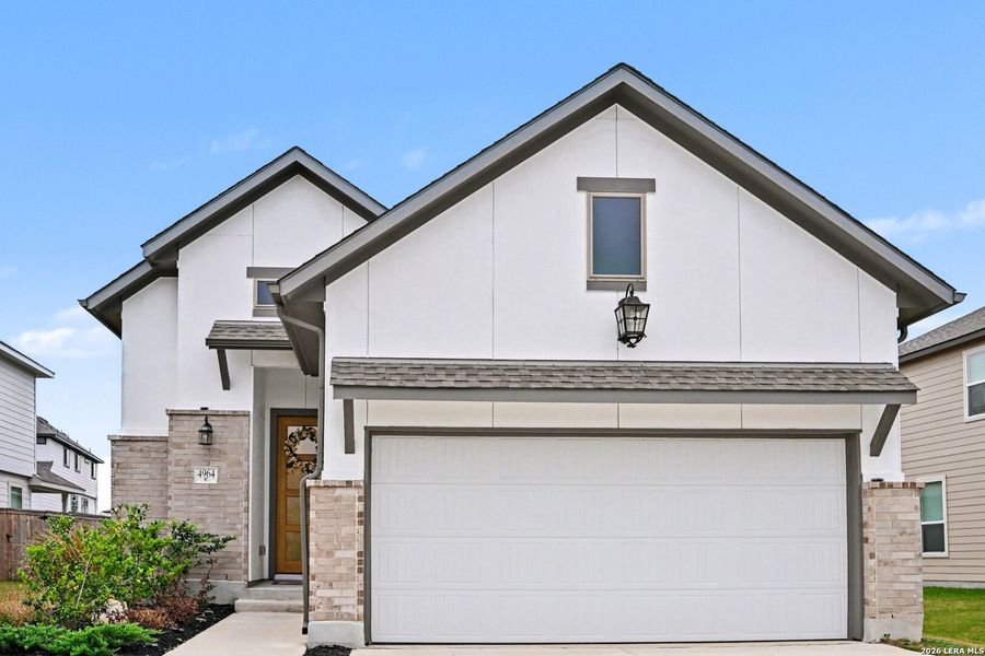 Front exterior of a new home in The Parklands, Schertz, TX, highlighting curb appeal (Image 24).
