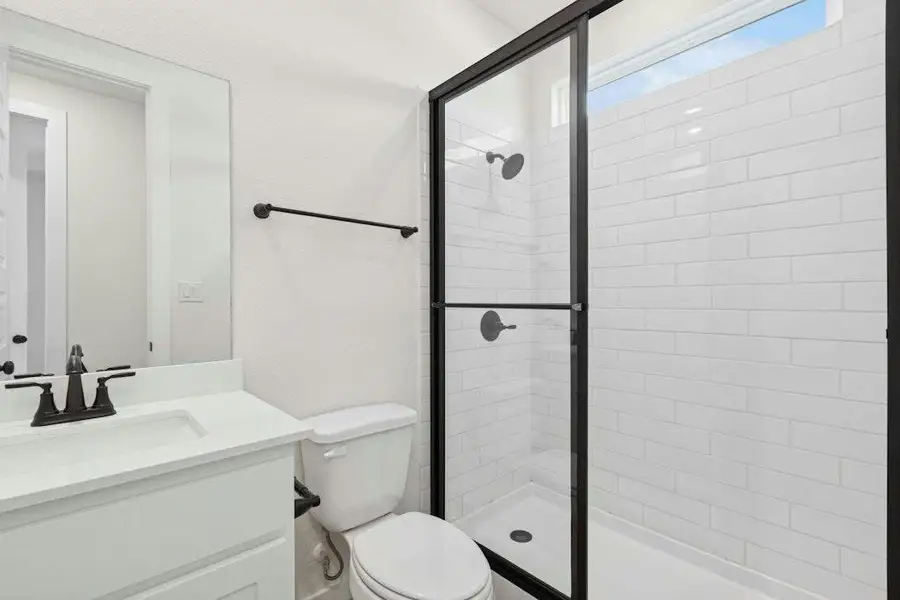 Bathroom with vanity and a stall shower