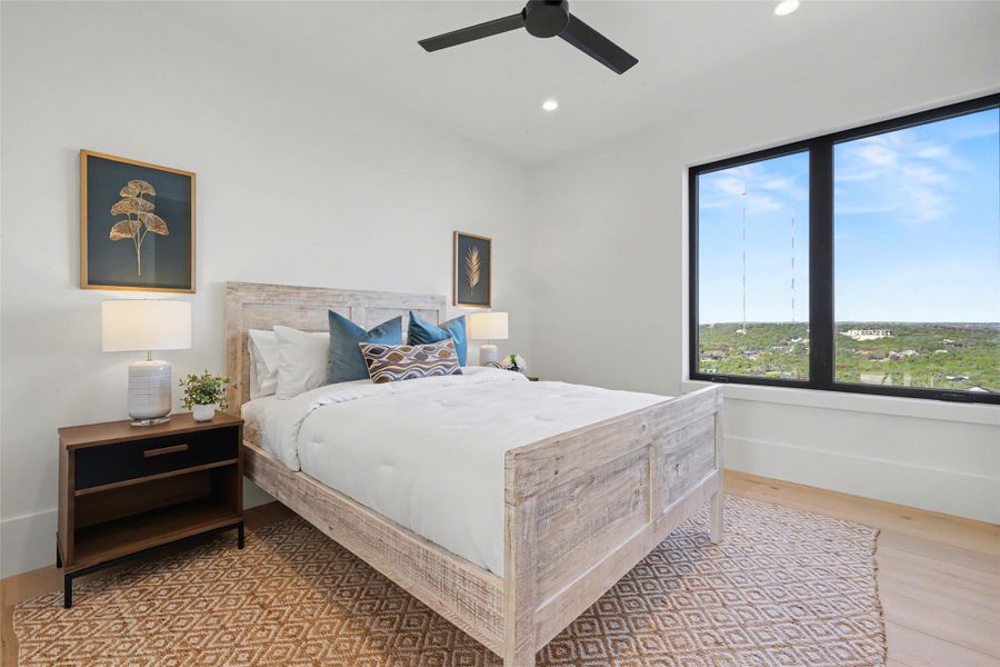 Bedroom featuring ceiling fan, light wood-style flooring, and recessed lighting