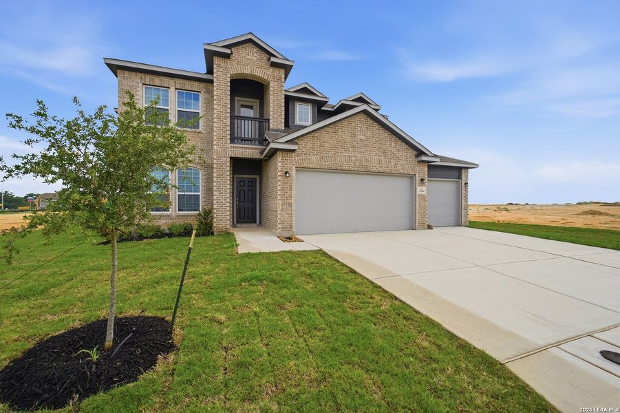 Front exterior of a new home in Hickory Ridge, Elmendorf, TX, highlighting curb appeal (Image 20).