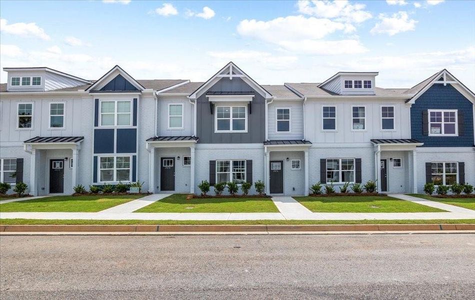 Front exterior of a new home in Shoals Crossing, Conyers, GA, highlighting curb appeal (Image 1). Front exterior of a new home in Shoals Crossing, Conyers, GA, highlighting curb appeal (Image 1).