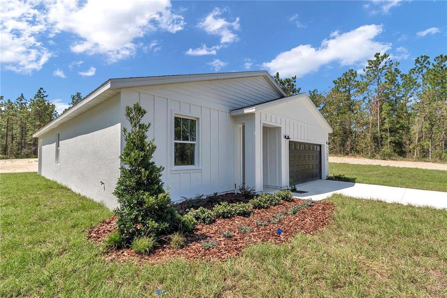 Front exterior of a new home in , Dunnellon, FL, highlighting curb appeal (Image 26).