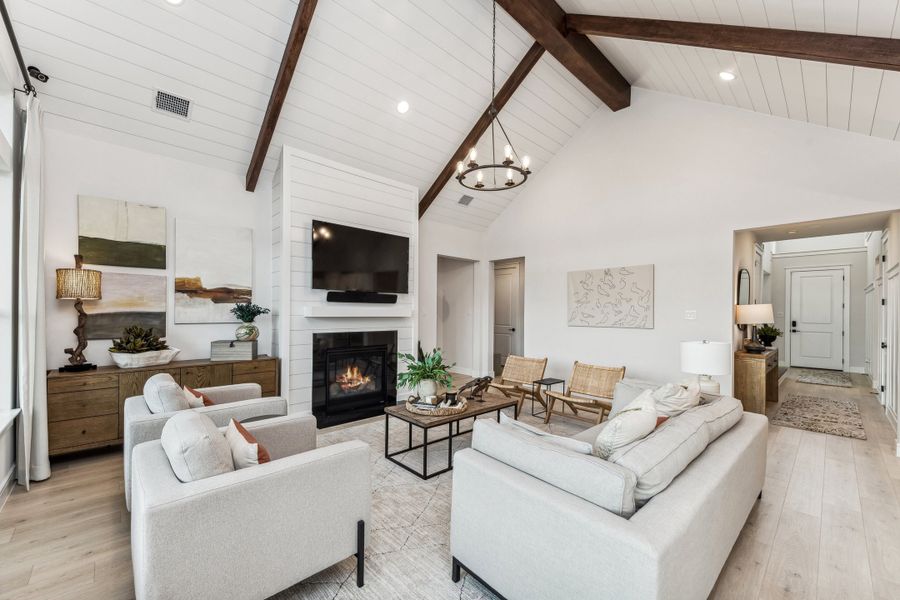 Great room with vaulted ceiling, shiplap and stained beams