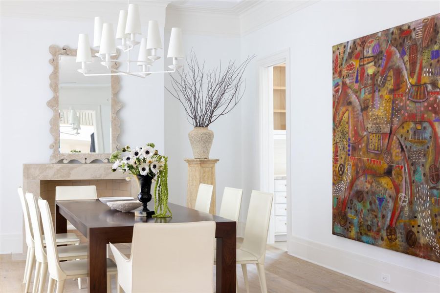 The formal dining room includes a gas log fireplace that provides both warmth and an elevated sense of comfort The formal dining room includes a gas log fireplace that provides both warmth and an elevated sense of comfort