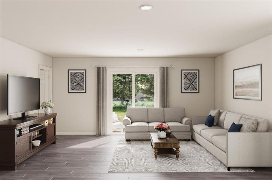 Living area with baseboards and wood finished floors Living area with baseboards and wood finished floors