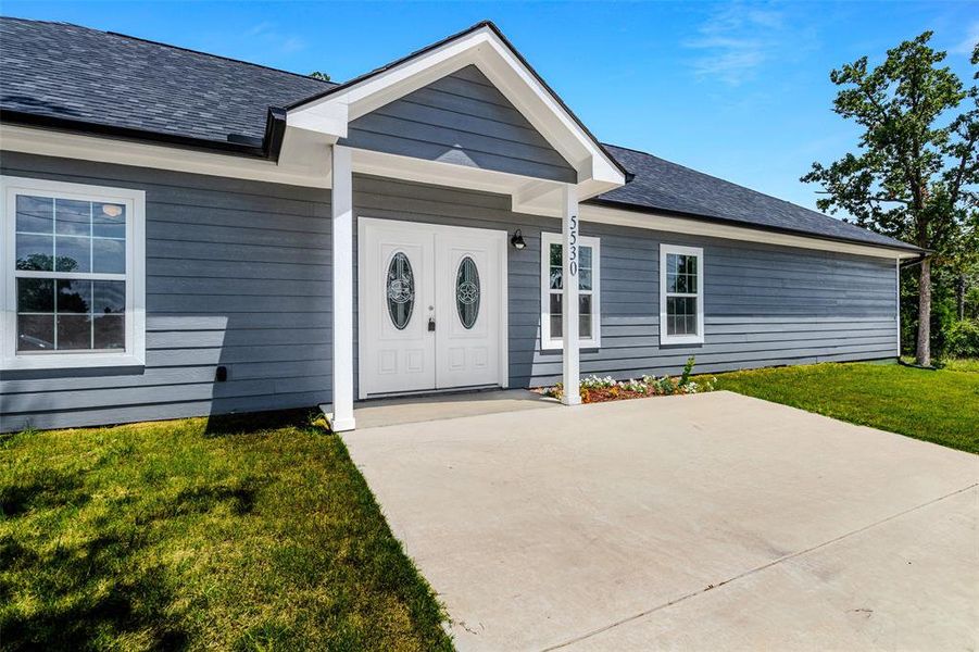 Front exterior of a new home in , Log Cabin, TX, highlighting curb appeal (Image 19).
