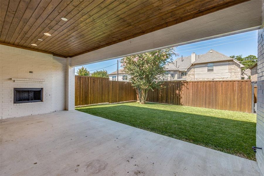 Backyard with Covered Patio and Outdoor Fireplace