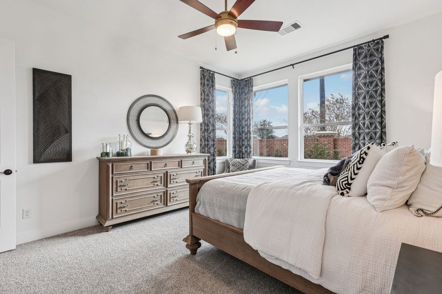 Representative furnished interior of a home built from the Oxford by Chesmar Homes in Sunterra, Katy (Image 6).