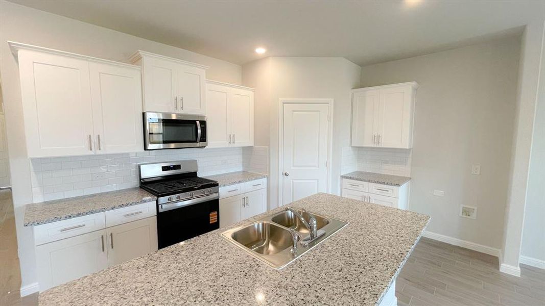 Kitchen - All Home and community information, including pricing, included features, terms, availability and amenities, are subject to change at any time without notice or obligation. All Drawings, pictures, photographs, video, square footages, floor plans, elevations, features, colors and sizes are approximate for illustration purposes only and will vary from the homes as built.