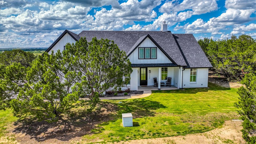 Representative exterior photo of a completed home built from the Lakeshore by Zeal Home Builders in Sunrise Point, Weatherford, TX (Image 19). Representative exterior photo of a completed home built from the Lakeshore by Zeal Home Builders in Sunrise Point, Weatherford, TX (Image 19).