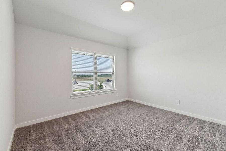 Bedroom in the Oscar home plan by Trophy Signature Homes – REPRESENTATIVE PHOTO