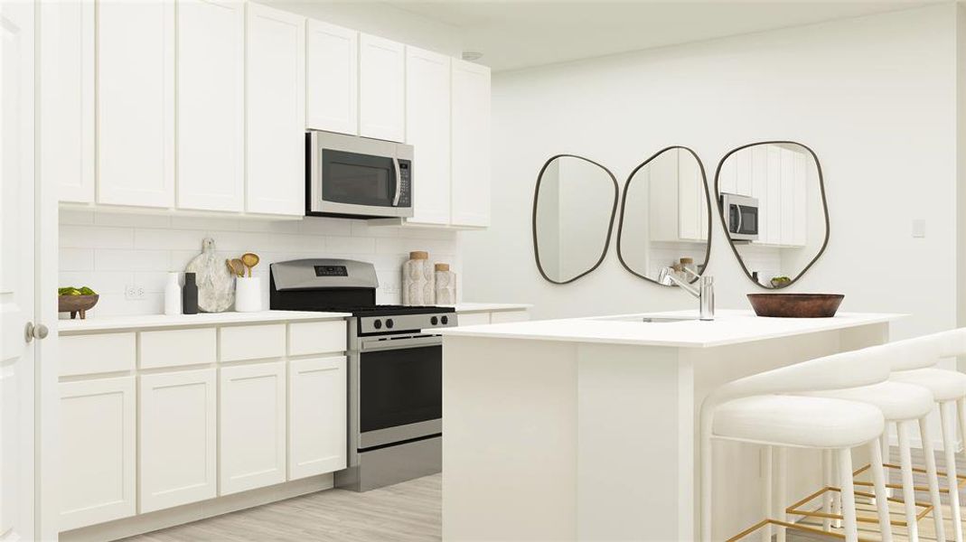 Kitchen with sink, appliances with stainless steel finishes, backsplash, white cabinets, and a center island with sink