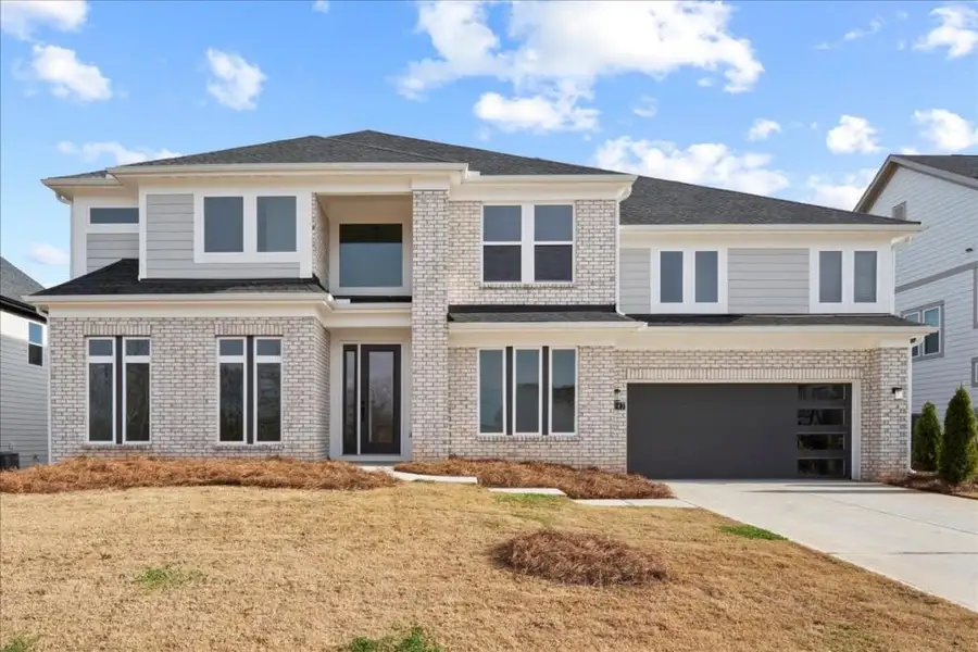 Front exterior of a new home in Twin Lakes, Hoschton, GA, highlighting curb appeal (Image 1).