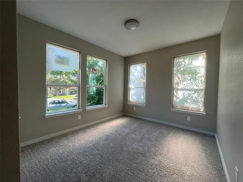 Unfurnished room with carpet