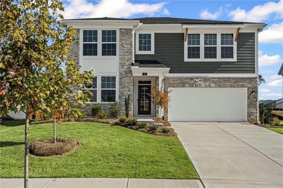 Front exterior of a new home in The Reserve At Liberty Park, Braselton, GA, highlighting curb appeal (Image 21). Front exterior of a new home in The Reserve At Liberty Park, Braselton, GA, highlighting curb appeal (Image 21).
