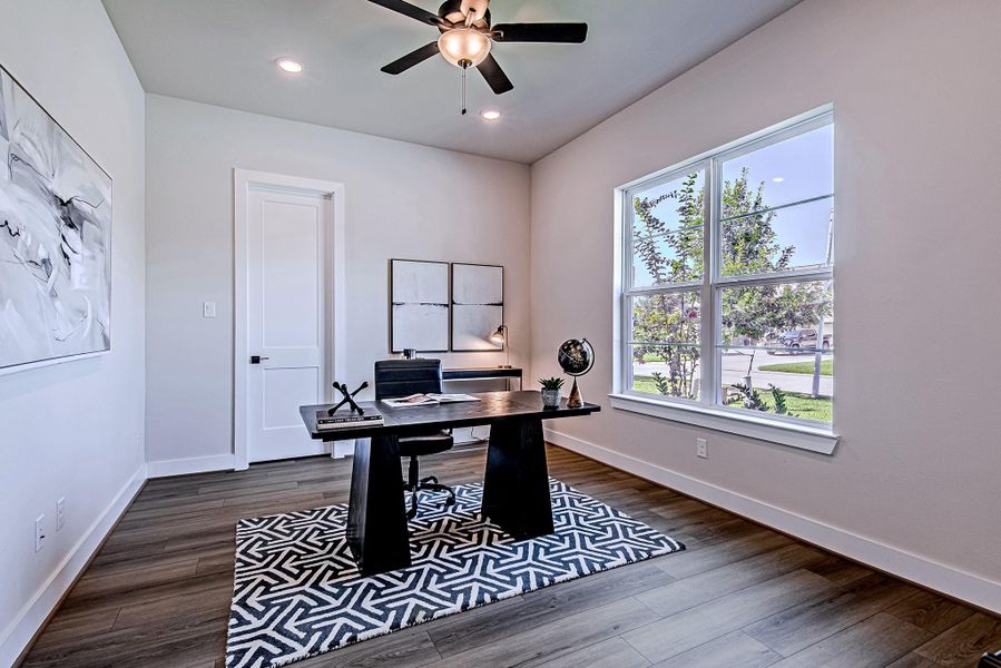 Private home office with French doors, a ceiling fan, and abundant natural light