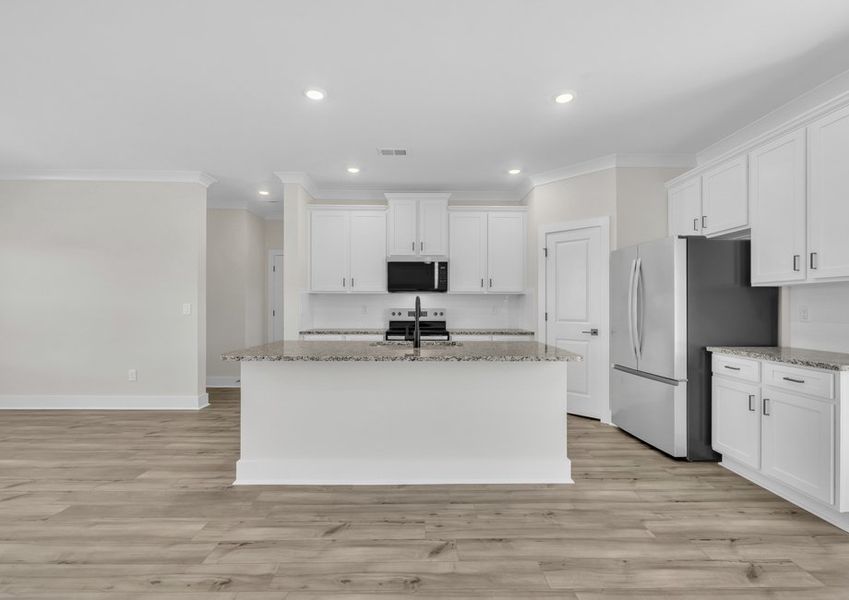 The kitchen has a spacious kitchen island. The kitchen has a spacious kitchen island.