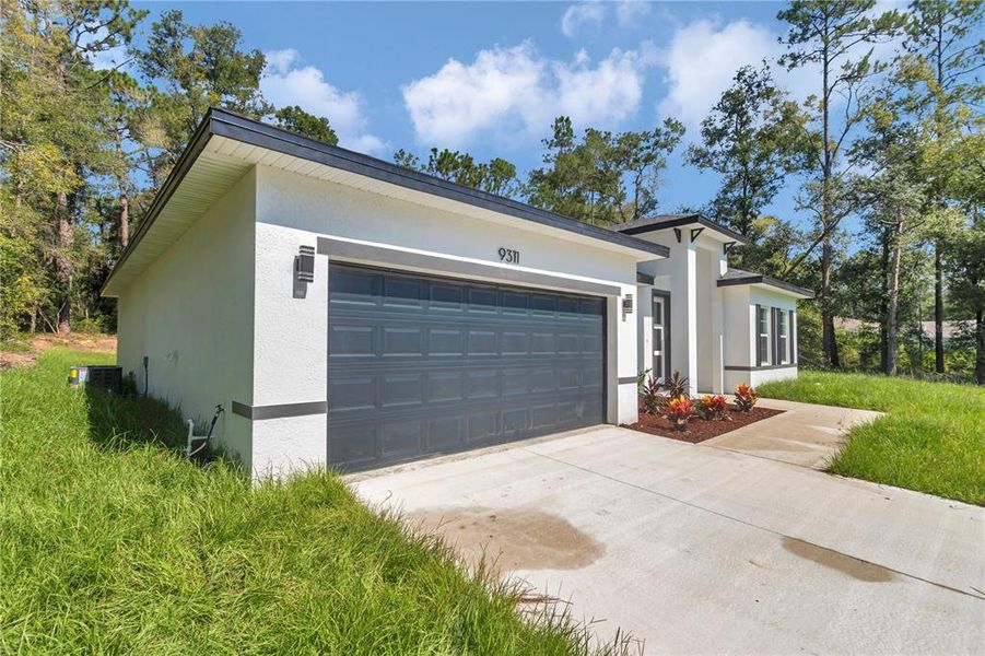 Front exterior of a new home in , Citrus Springs, FL, highlighting curb appeal (Image 26).