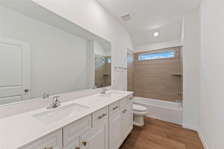 Furnished interior view inside a new home in Sunterra, Katy (Image 10).