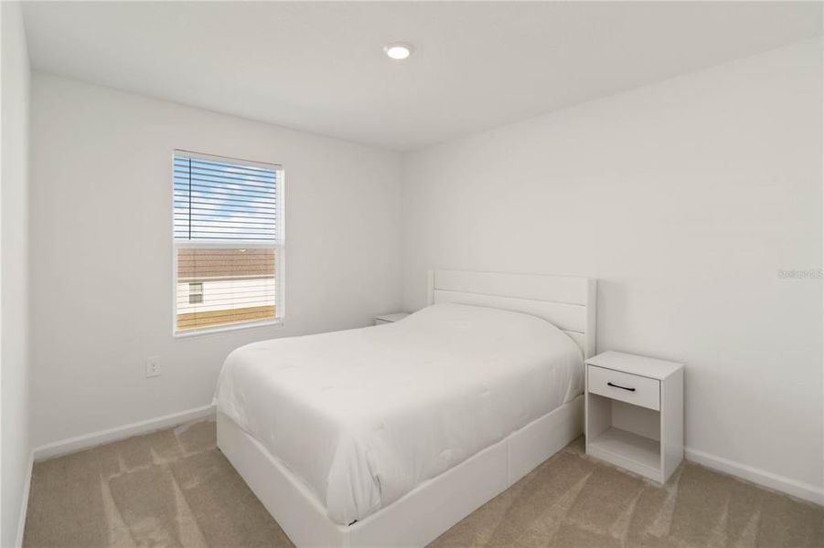 Furnished interior view inside a new home in Peace Creek Reserve: Manor Key Collection, Winter Haven (Image 39).
