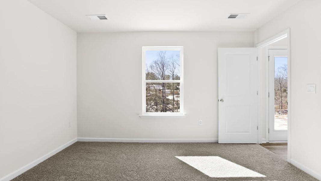 Spacious, unfurnished interior of a new home in Village Grove, Greenville (Image 28).