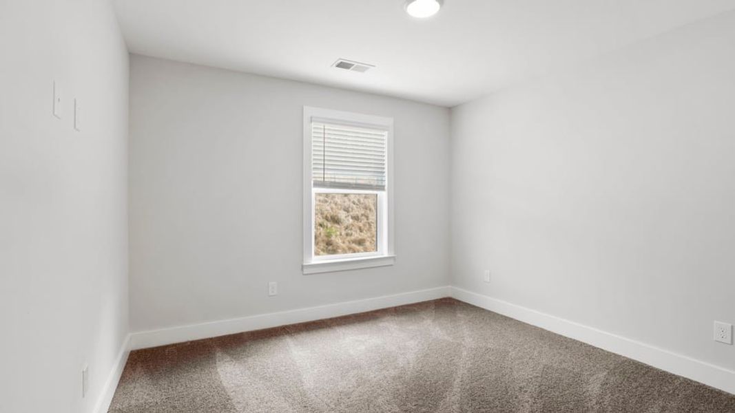 Representative unfurnished interior of a home built from the Bakersfield by D.R. Horton in Edgewood Estates, Greenville (Image 26).