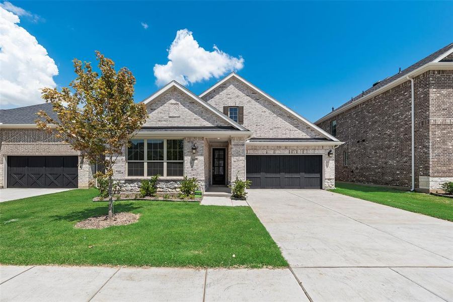 Front exterior of a new home in Arbors at Legacy Hills, Celina, TX, highlighting curb appeal (Image 17). Front exterior of a new home in Arbors at Legacy Hills, Celina, TX, highlighting curb appeal (Image 17).