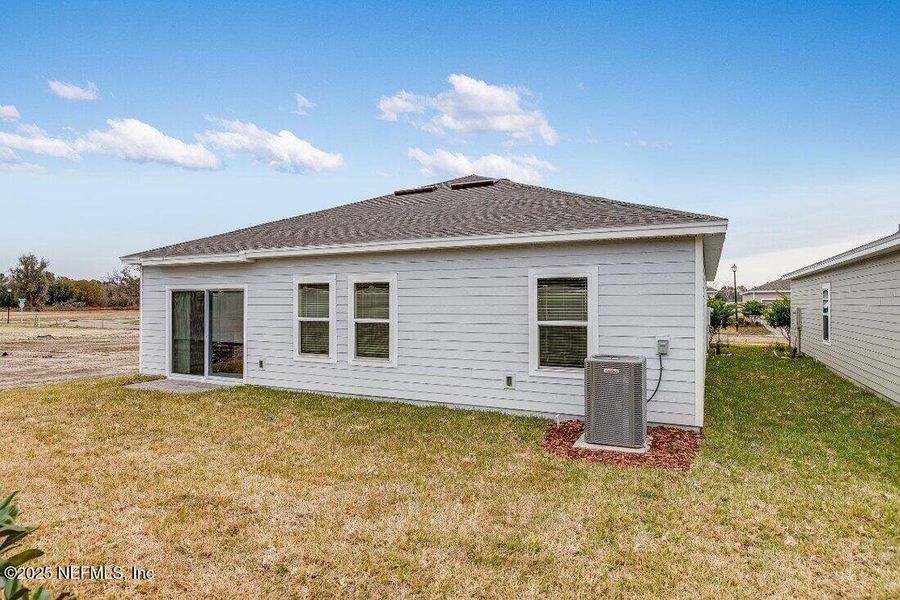 Front exterior of a new home in Coopers Meadow, Jacksonville, FL, highlighting curb appeal (Image 19).