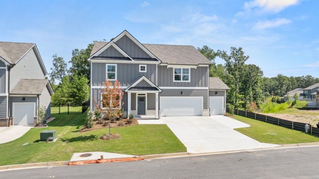 Front exterior of a new home in Falcon Landing, Gainesville, GA, highlighting curb appeal (Image 1). Front exterior of a new home in Falcon Landing, Gainesville, GA, highlighting curb appeal (Image 1).
