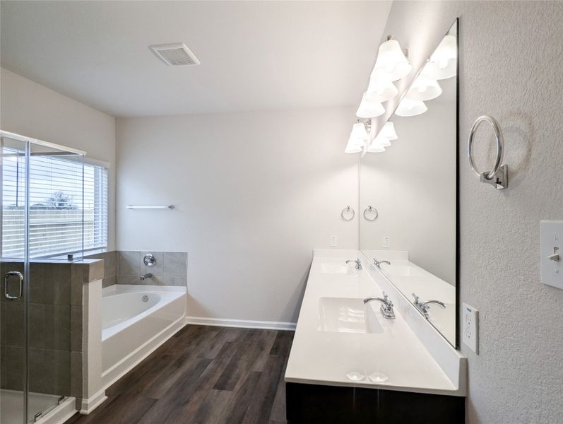 Master bath has double vanities