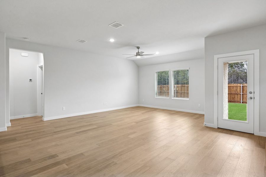 Living and Dining Room in the Heisman home plan by Trophy Signature Homes – REPRESENTATIVE PHOTO