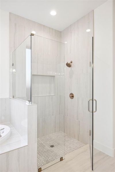 Bathroom featuring wood-type flooring and independent shower and bath