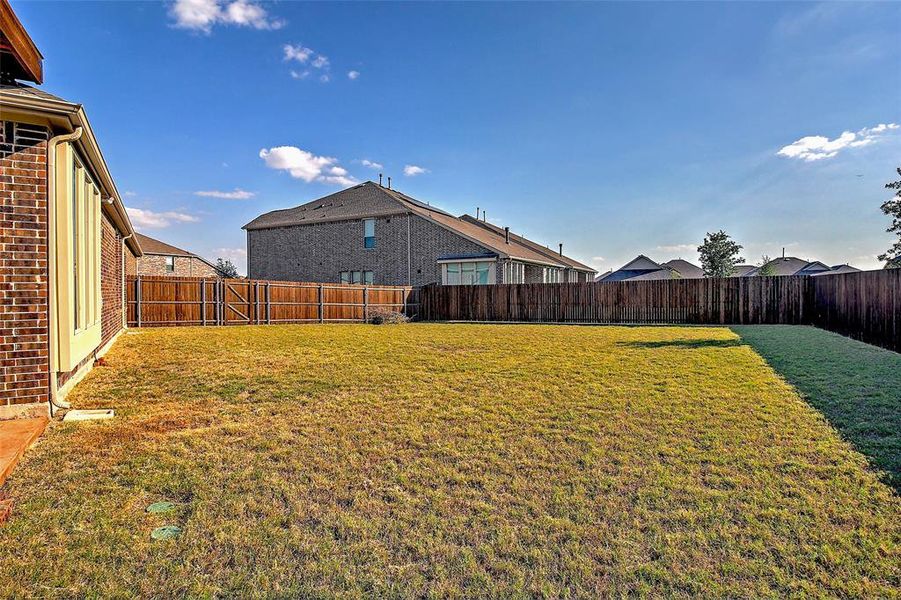 Exterior details and patio area of a home in Preserve at Honey Creek: Brookstone Collection, McKinney (Image 3).