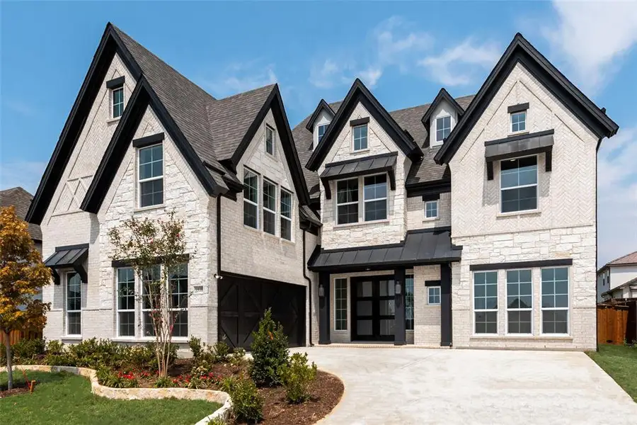 Front exterior of a new home in Somerset Park, Rockwall, TX, highlighting curb appeal (Image 1). Front exterior of a new home in Somerset Park, Rockwall, TX, highlighting curb appeal (Image 1).