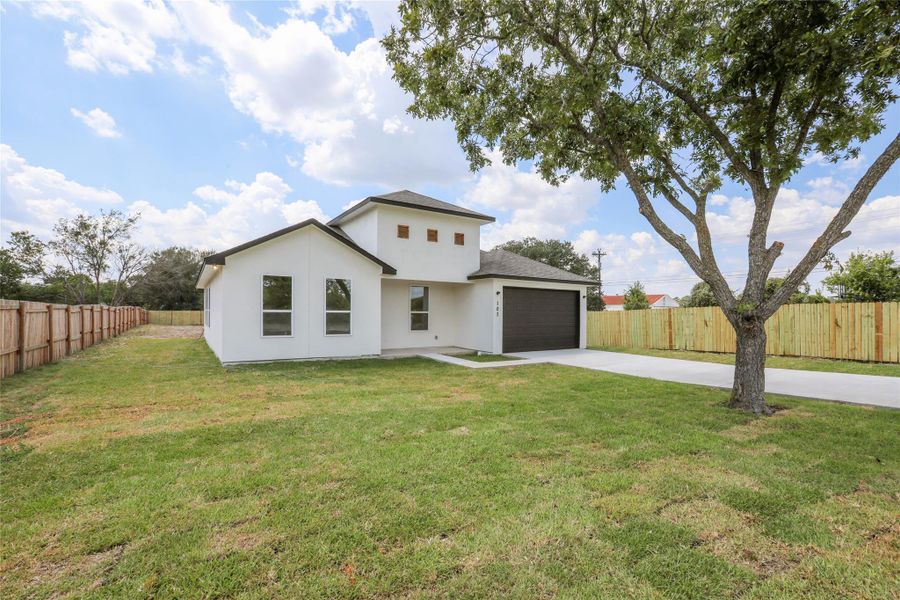 Front exterior of a new home in , Bastrop, TX, highlighting curb appeal (Image 23). Front exterior of a new home in , Bastrop, TX, highlighting curb appeal (Image 23).