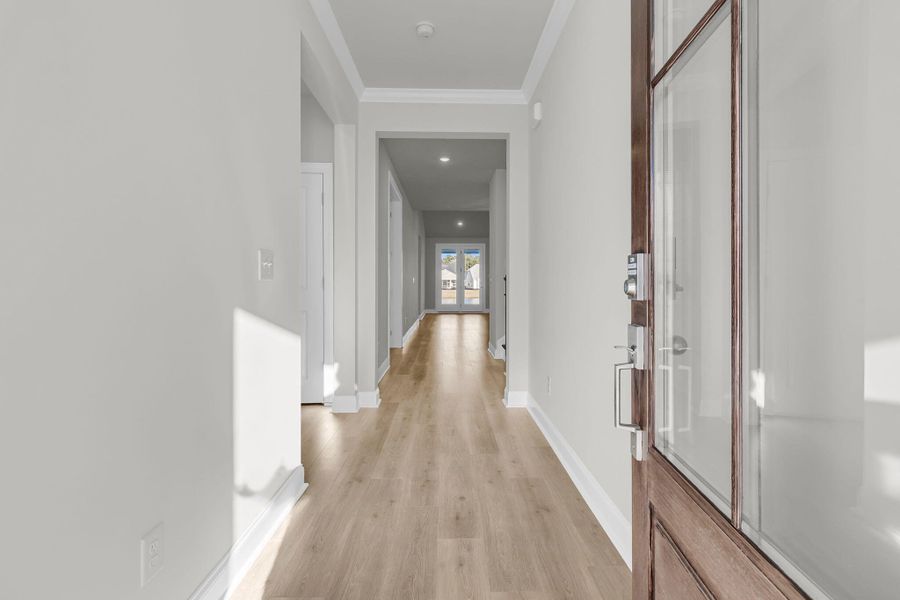 Spacious, unfurnished interior of a new home in Tidewater at Lakes of Cane Bay, Summerville (Image 19).