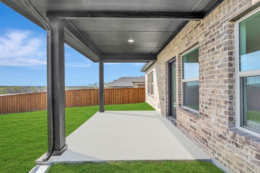 Exterior details and patio area of a home in Aspire at Reunion, Newark (Image 3).