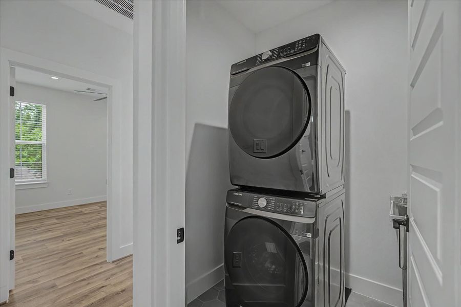 Samsung 5.0 cu. ft. Smart Front Load Washer featuring Steam Wash technology and a sleek brushed black finish. This high-efficiency, Wi-Fi-enabled washer uses steam to tackle tough stains while remaining gentle on fabrics, and the Super Speed Wash cycle cleans a full load in just 28 minutes.Matching Samsung 7.5 cu. ft. Smart Electric Dryer in brushed black. This stackable, Wi-Fi-enabled dryer features Sensor Dry technology, which automatically optimizes drying time and temperature to protect clothing.