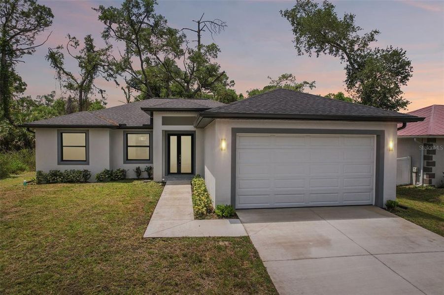 Front exterior of a new home in , Port Charlotte, FL, highlighting curb appeal (Image 21).