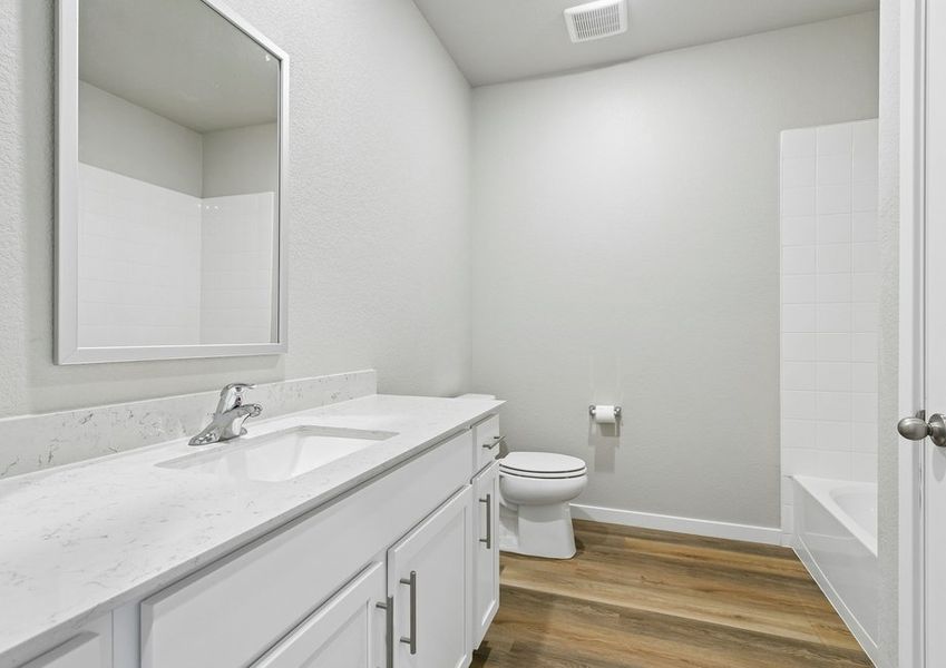 The secondary bathroom has a tub/shower combo.