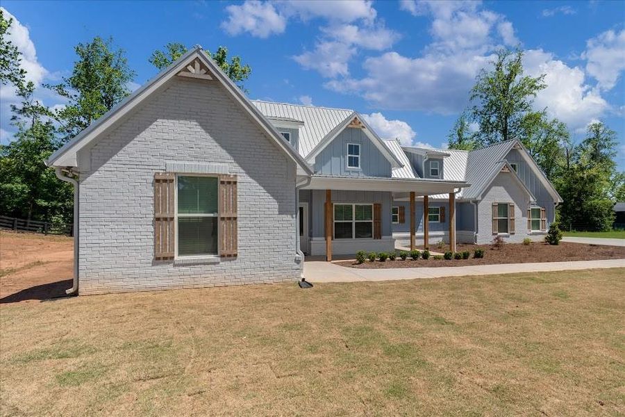 Front exterior of a new home in , Bremen, GA, highlighting curb appeal (Image 12).