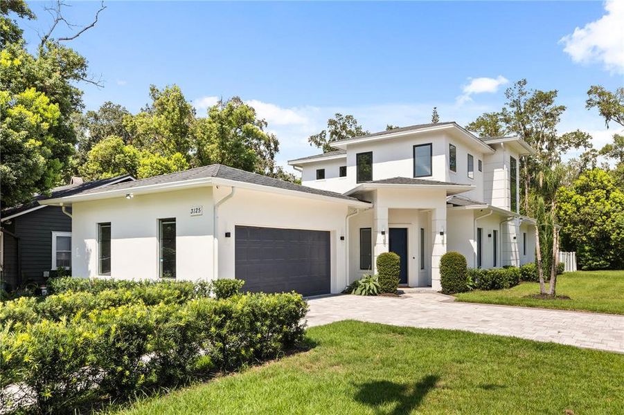 Front exterior of a new home in , Orlando, FL, highlighting curb appeal (Image 2). Front exterior of a new home in , Orlando, FL, highlighting curb appeal (Image 2).