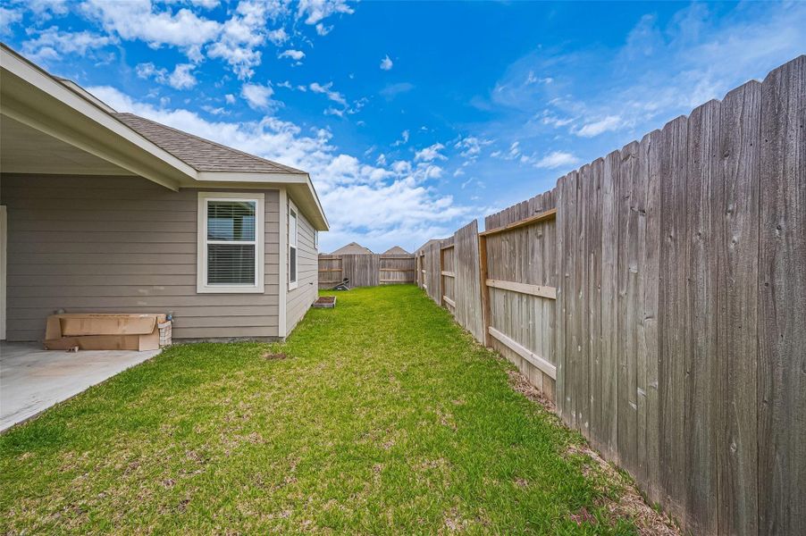Exterior details and patio area of a home in Sunterra, Katy (Image 28).