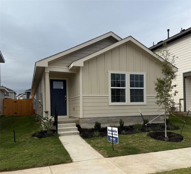 Front exterior of a new home in Valverde, Bastrop, TX, highlighting curb appeal (Image 1).