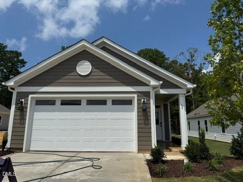 Front exterior of a new home in The Walk at East Village, Clayton, NC, highlighting curb appeal (Image 15).