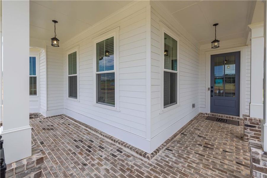 Exterior details and patio area of a home in Promenade at Sawnee Village, Cumming (Image 26).