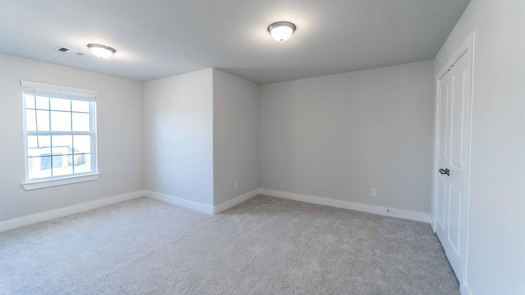 Spacious, unfurnished interior of a new home in Sunterra, Katy (Image 11).